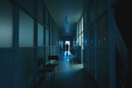 A scene from the film All You Need Is Death. At the end of the corridor you can see Catherine Siggins' character Agnes walking away.
